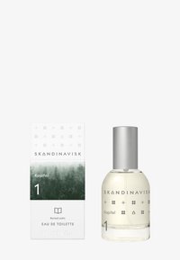 Eau de toilette bottle with a round shape, clear glass, silver cap, and white box featuring green forest imagery and minimalist design.