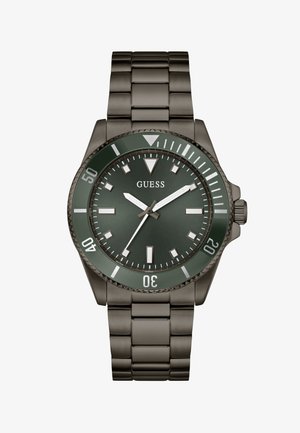 Men's Guess wristwatch with dark green dial, silver hour markers, rotating bezel, and stainless steel link bracelet.