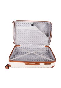Hard-shell suitcase with a cream exterior and brown accents. Interior features a patterned lining, straps for securing items, and a zippered compartment.