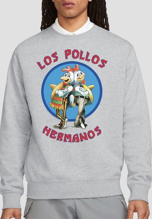 Gray sweatshirt featuring a circular graphic of two cartoon chickens, "Los Pollos Hermanos" text in red above and below the graphic.