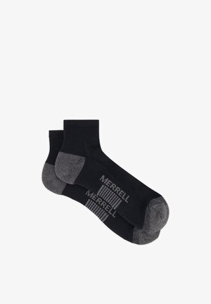 Pair of black ankle socks with grey heels and toes, featuring "MERRELL" branding and vertical stripes on the foot arch.