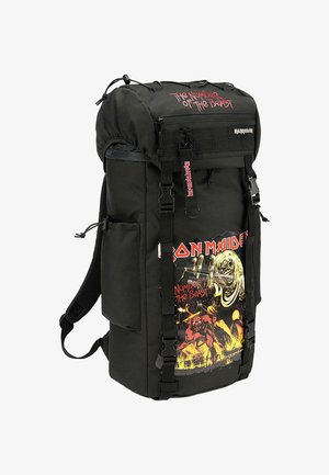 Black backpack with adjustable straps, features "Iron Maiden" and "Number of the Beast" graphic in vibrant colors on one side, durable material.
