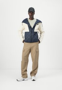 Helly Hansen STOWE HOODED HYBRID JACKET UNISEX - Zimní bunda - navy