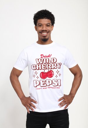 White T-shirt featuring a red and black graphic with cherries and the text "Drink! WILD CHERRY PEPSI LIGHT AND REFRESHING". Short sleeves.