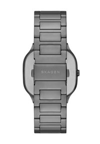 Orologio da polso con bracciale in acciaio inossidabile nero opaco, maglie rettangolari e cassa nera liscia. Nome del marchio "SKAGEN" inciso sulla fibbia.