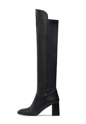 Black knee-high boots featuring a smooth leather exterior, block heel, and sleek design with contrasting textile panel on the back.