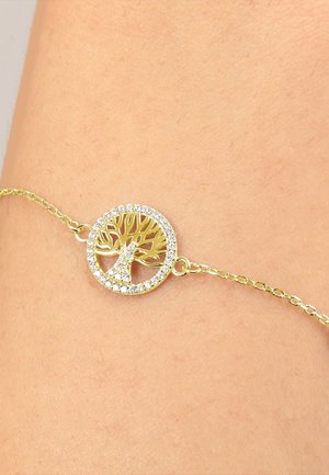 Bracciale dorato con un design ad albero circolare, impreziosito da cristalli trasparenti, su una delicata catena.