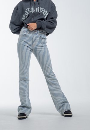 FLAMING TIGER  - Flared jeans - blue
