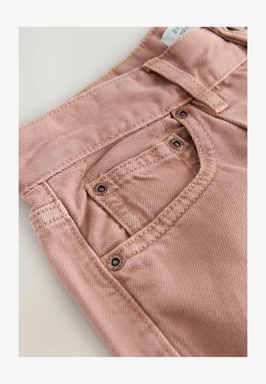 Pink denim jeans featuring a button closure, angled front pockets, and visible stitching details with a soft, textured fabric.