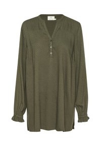 Chemisier à manches longues vert olive avec un motif en losanges, décolleté en V, patte de boutonnage à deux boutons et poignets froncés. Texture douce et coupe décontractée.
