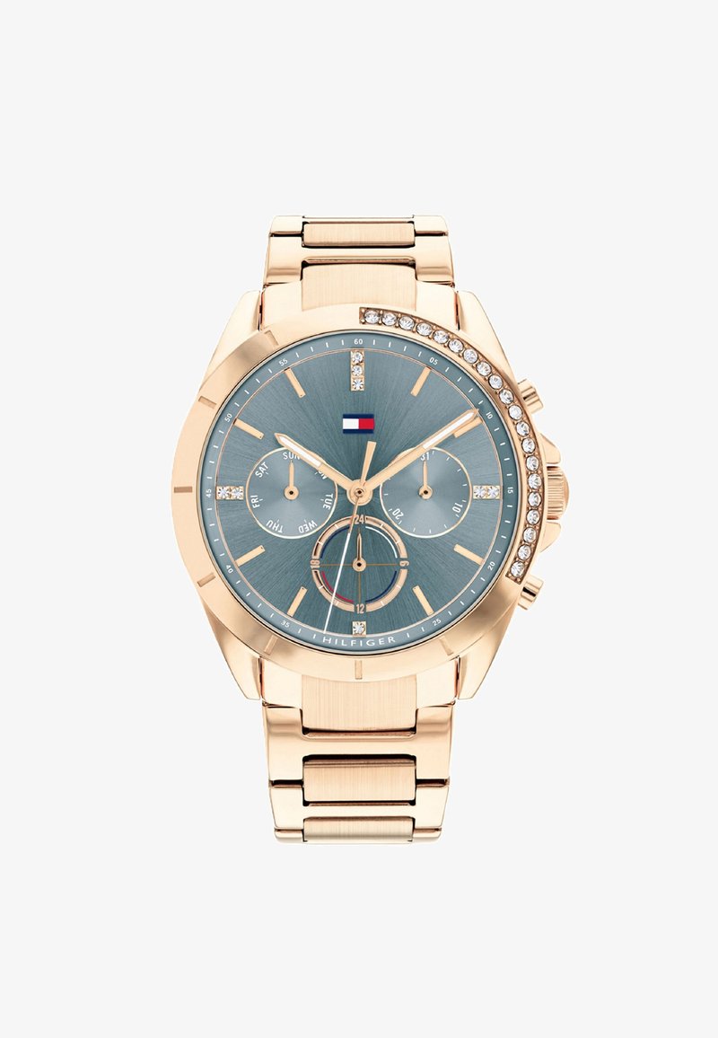 Roosa kuldne kell sinise tekstuuriga kellatahvli, kristallaktsentide ja mitmefunktsionaalse alusekellaga, poleeritud metallpaelal.