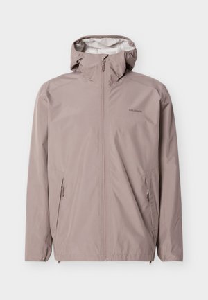 Jasnoróżowa kurtka z kapturem, z pełnym zamkiem z przodu, dwoma zamykanymi na zamek bocznymi kieszeniami oraz logo "Salomon" na lewej piersi.