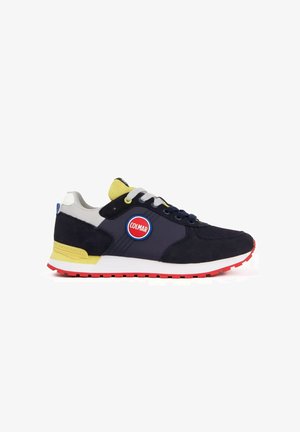Heren sneaker in marineblauw met gele accenten, rode zool, witte veters en een rond Colmar-logo aan de zijkant.
