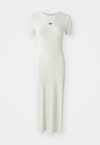 Ribbed, ankle-length dress in pale green with short sleeves and a round neckline, featuring a small red embroidered logo on the chest.
