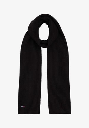 Czarny dziergany szalik o prążkowanej fakturze. Posiada pętlasty design oraz małe logo zdobiące jedno z końców.