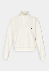 Crème kleurige pullover sweatshirt met een halve rits, ribgebreide mouwen en zoom. Beschikt over een klein logo op de linkerborstzak.