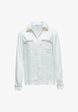 Witte blouse met lange mouwen, voorzien van een gestructureerde afwerking op de kraag, borstzakken en manchetten, met een knoopsluiting aan de voorkant en een klassieke kraag.