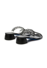 Transparent sandals with a flat black heel, embellished with clear rhinestones on straps, featuring a sleek, modern design.