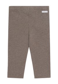 Leggings marroni di lunghezza vicino al ginocchio con un piccolo etichetta bianca del marchio vicino all'elastico in vita sul lato destro.