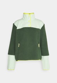 Polarowy sweter w ciemnozielonym i jasnym miętowym kolorze, z wysokim kołnierzem, napami i kieszeniami na zamek błyskawiczny z jasnoszarymi akcentami.