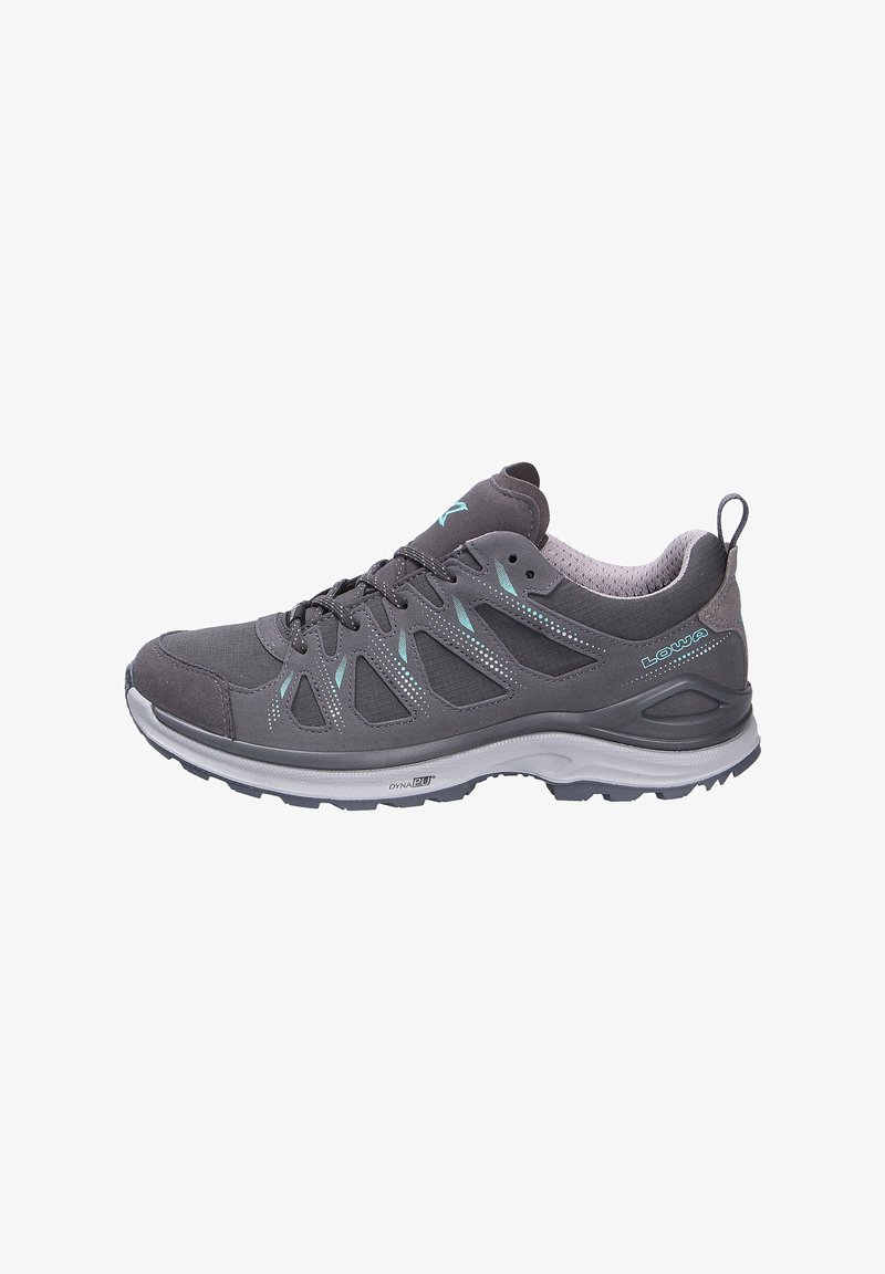 Gray outdoor shoe with a mesh upper, teal accents, and a rubber sole. Features a padded collar and lace-up design for secure fit.
