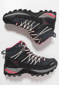 Black waterproof hiking boots with gray accents, contrasting pink details, and white laces. Features textured fabric and rugged tread sole.