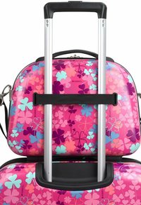 Hard-shell luggage with a pink floral design featuring various colors. Includes a silver telescopic handle and a black strap for stability.