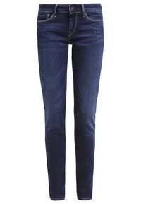 Jeans de denim azul oscuro con un corte ajustado. Presentan un diseño clásico de cinco bolsillos, detalles de costura dorada y un acabado ligeramente descolorido.