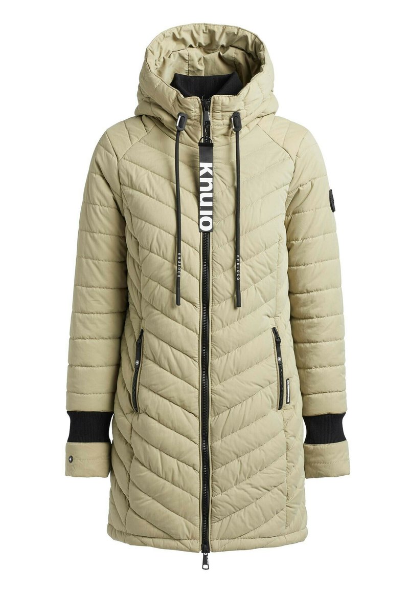 Hellbeige gesteppter langer Wintermantel mit Kapuze, schwarzen gerippten Innenbündchen, Frontreißverschluss, seitlichen Reißverschluss-Taschen und Kordelzügen mit Schriftzug.