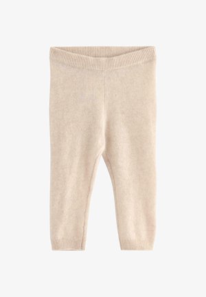 Beżowe dzianinowe spodnie dla małych dzieci z prążkowanym pasem i mankietami, wykonane z miękkiego, teksturowanego materiału, zaprojektowane z myślą o komforcie i ciepłocie.