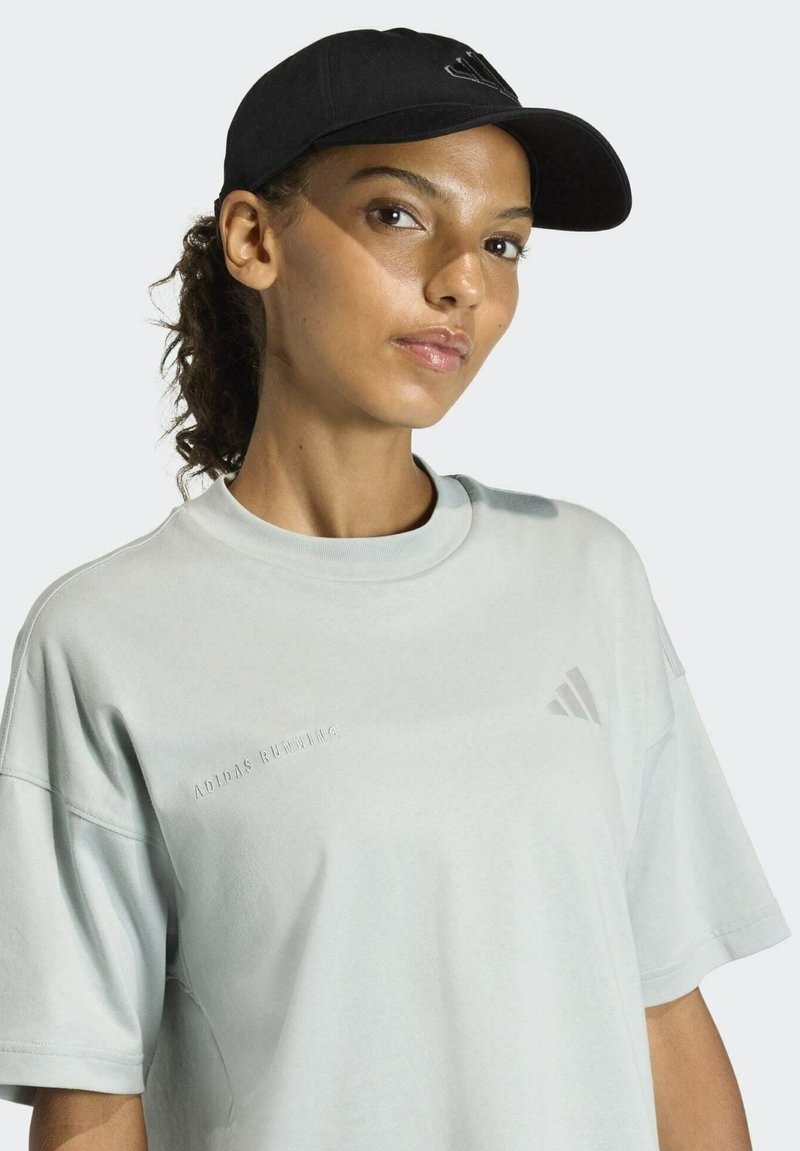 Light blue cotton t-shirt with a round neckline, short sleeves, and embossed "ADIDAS RUNNING" text. Black cap with logo accents.