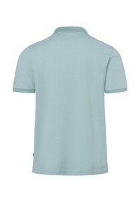 Ljusblå kortärmad polotröja med ett strukturerat randigt mönster, en enfärgad krage och en rak nederkant.