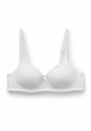 Reggiseno bianco in pizzo con coppe imbottite, spalline regolabili e un delicato strato di pizzo sovrapposto. Presenta una chiusura con ganci sul retro.