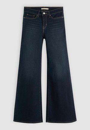 Jean en denim bleu foncé à taille haute et coupe large. Il présente un design classique à cinq poches et des coutures contrastantes le long des coutures.