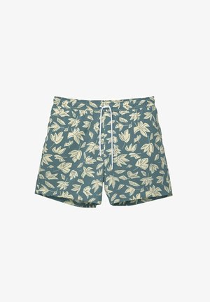 Shorts de bain en tissu bleu-vert avec un motif de feuilles en crème. Dotés d'une taille élastique et d'un cordon blanc pour ajustement.