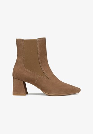 Brown suede ankle boots with a pointed toe, elastic side panels, and a block heel. Smooth texture and minimalist design.