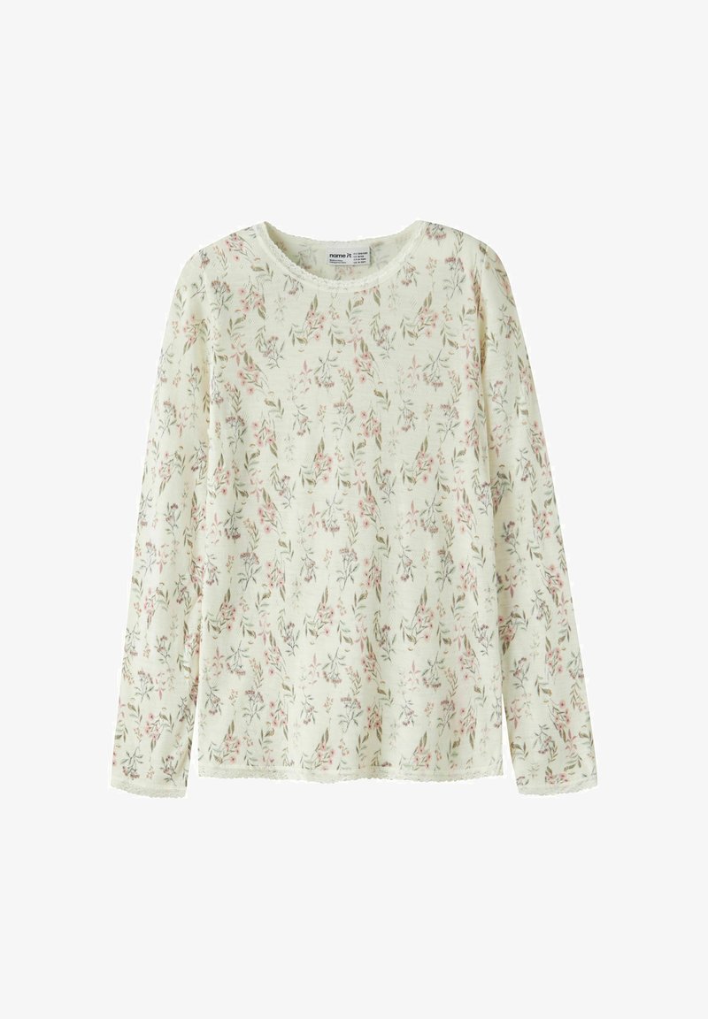 Chemise crème à manches longues avec petit imprimé floral rose et vert et délicate bordure en dentelle sur le col et les poignets.