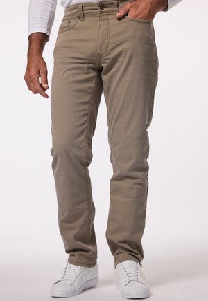 Beige slim-fit pants with a smooth texture, five pockets, and a classic button closure. Paired with white sneakers.