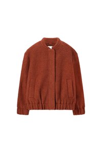 Veste en polaire orange brûlé avec un col rond, des poches avant et un ourlet élastiqué. Tissu texturé à l'apparence douce.