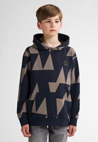 Sudadera con capucha de patrón geométrico en azul marino y beige, con un amplio bolsillo frontal y capucha ajustable con cordón. Confeccionada con una tela suave para mayor comodidad.