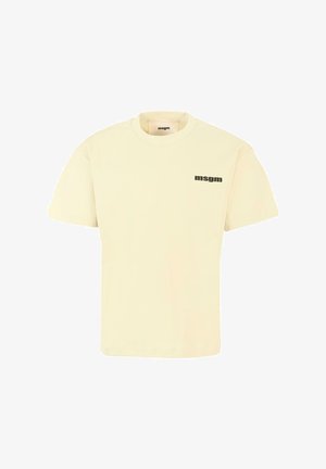 Kremowa bawełniana koszulka z okrągłym dekoltem i krótkimi rękawami, z czarnym nadrukowanym logo po lewej stronie klatki piersiowej.