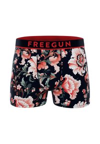 Boxers fleuris avec un fond noir, ornés de grands motifs de fleurs roses et vertes. Taille élastique avec "FREEGUN" en rouge.