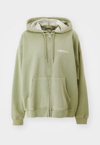 Zelená mikina na zips s mäkkým, plyšovým interiérom. Obsahuje dve predné vrecká a biely logo "ROXY" na hrudi. Kapucňa s nastaviteľnou šnúrkou.