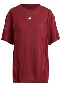 Camiseta deportiva roja con mangas cortas, cuello redondo, lados ventilados y un pequeño logo blanco en el pecho. Tejido liso y transpirable.