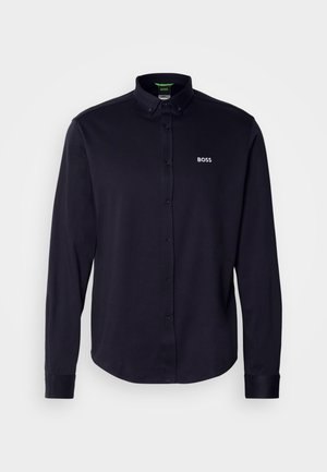 Navy long-sleeve button-up shirt with a collar, featuring a white "BOSS" logo on the chest, made from a smooth, textured fabric.