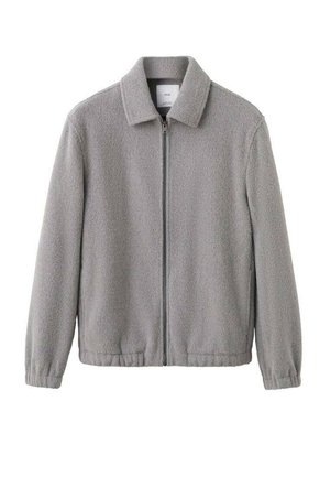 Gray fleece jacket with a zip front, collared neckline, elastic cuffs, and a slightly textured surface. Simple, casual design.