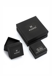 Black paper boxes in varying sizes with a matte texture. Each features the "Kuzzoi" logo prominently displayed on the top.
