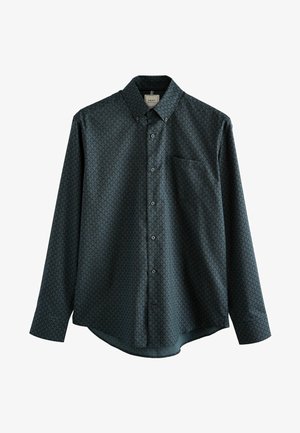 Camicia a maniche lunghe con bottoni di colore verde scuro con motivo a foglie, dotata di taschino sul lato sinistro del petto e colletto classico. Tessuto testurizzato.