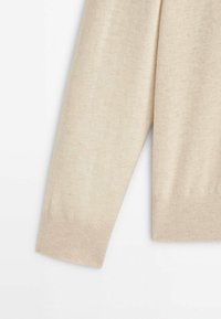 Beige long sleeve sweater with ribbed cuffs and hem, displayed flat on a white background.