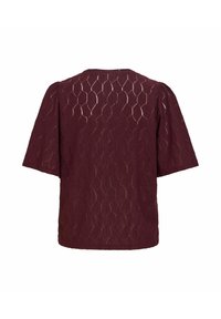 Haut rouge foncé à manches courtes avec motif hexagonal texturé et épaules légèrement bouffantes, présenté de dos sur un fond blanc.